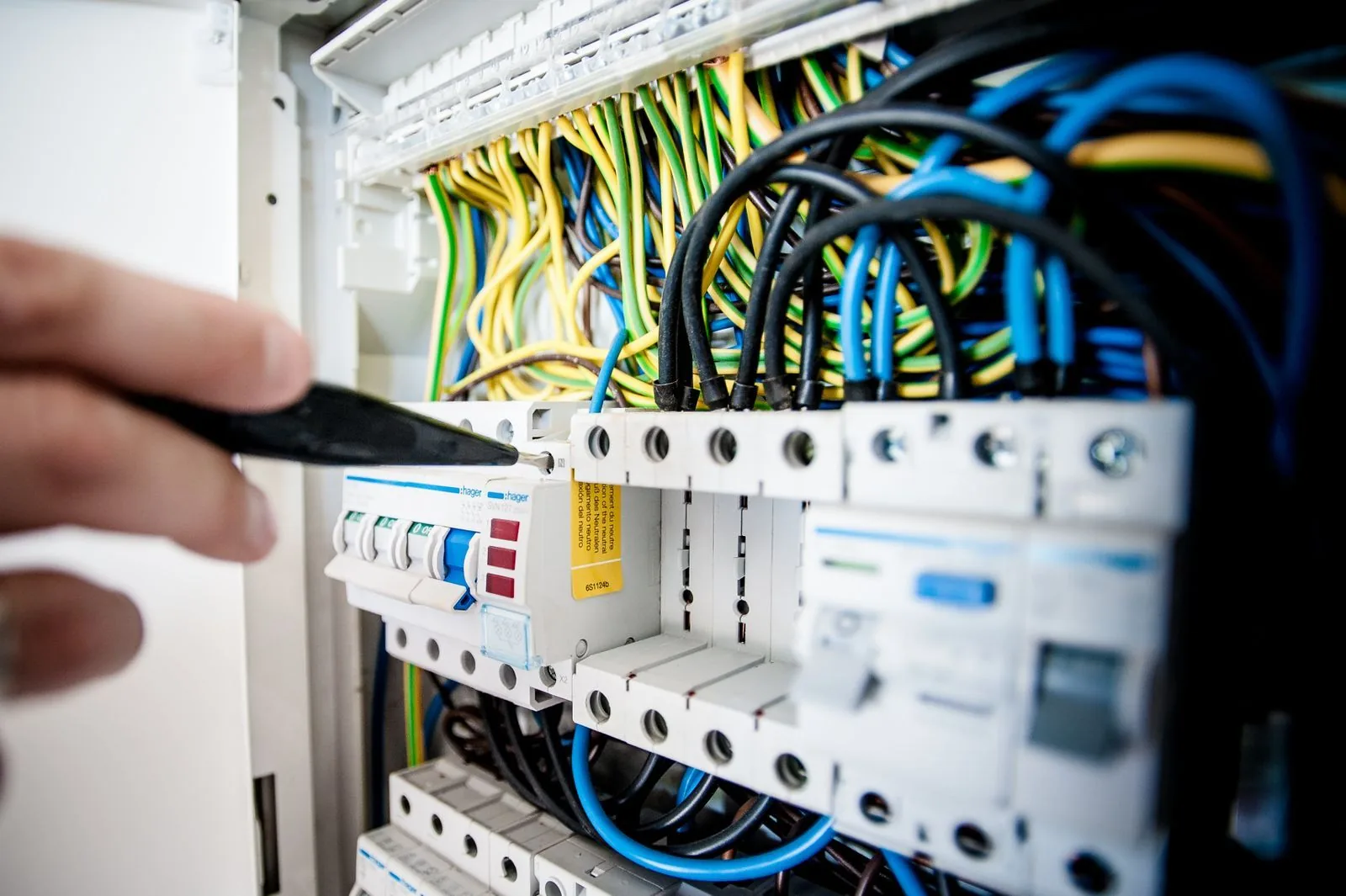 Close-up of an electrical breaker panel with colored wires