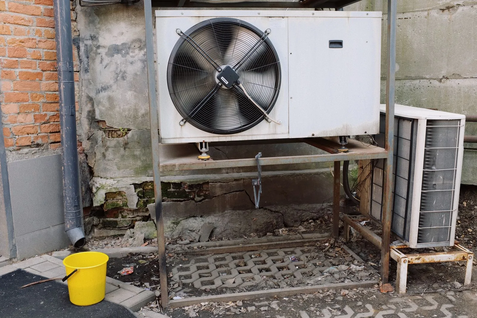 Outdoor air conditioning condenser units on a metal stand