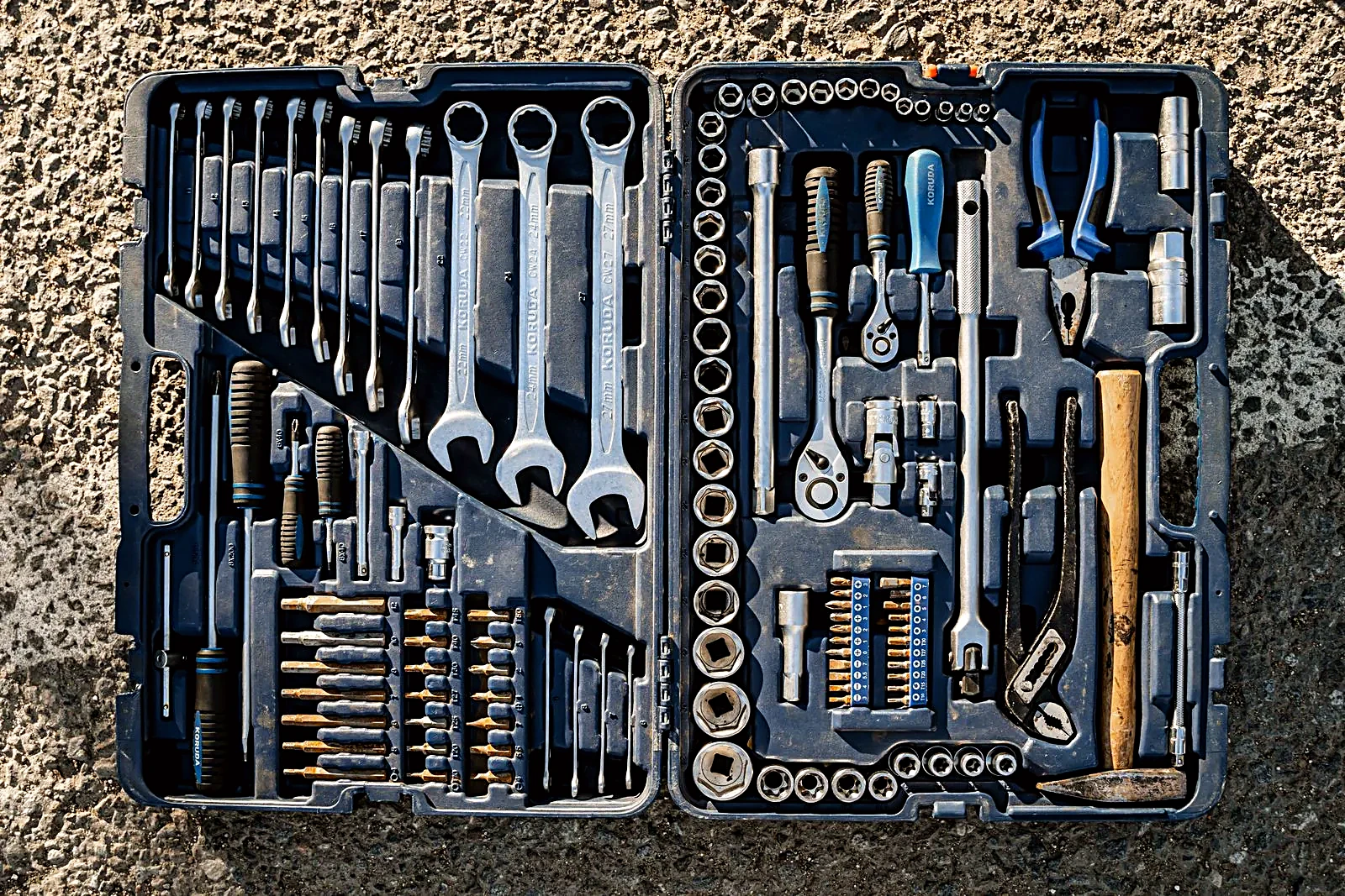 Open toolbox with an organized set of wrenches