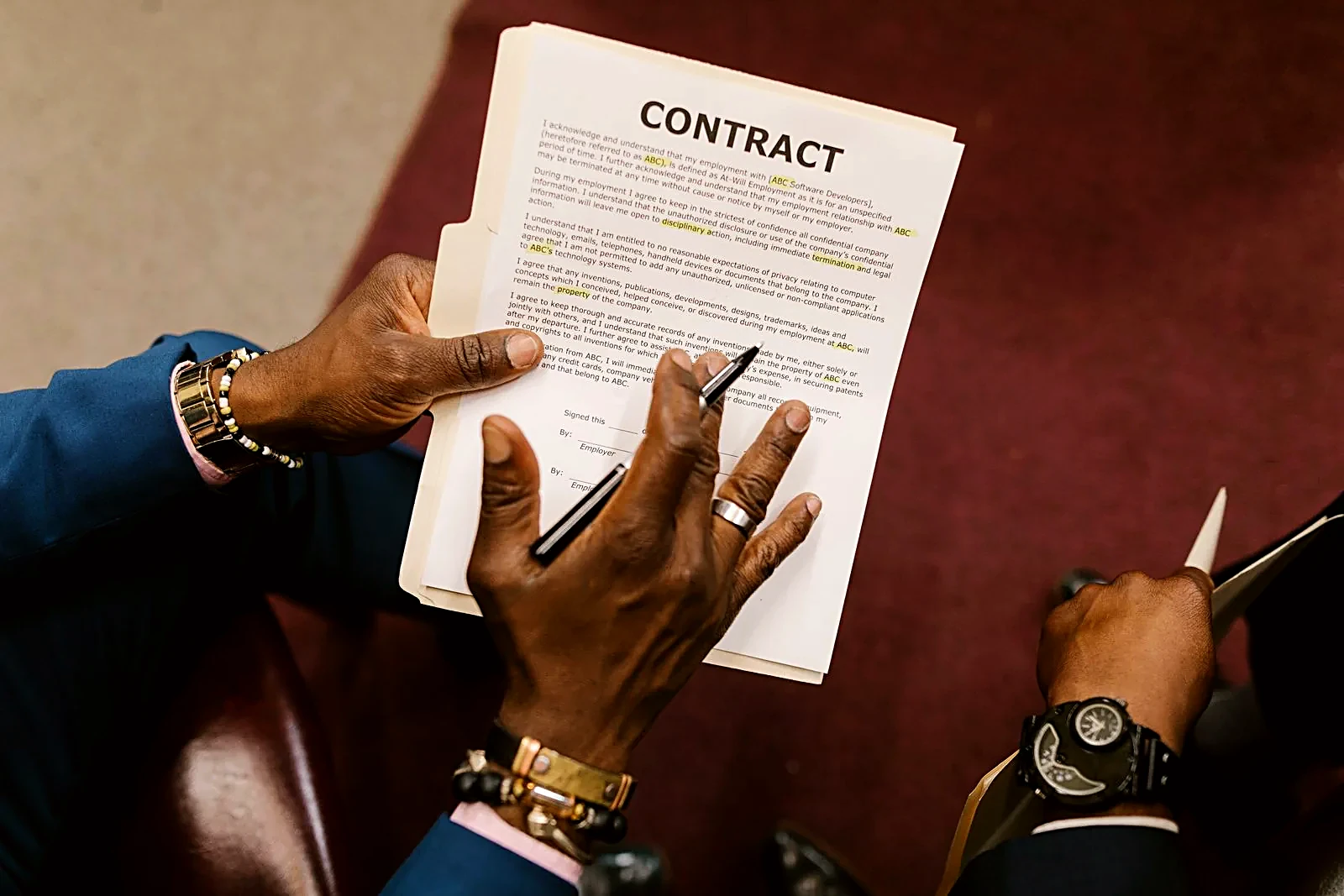 Overhead view of hands signing a business contract